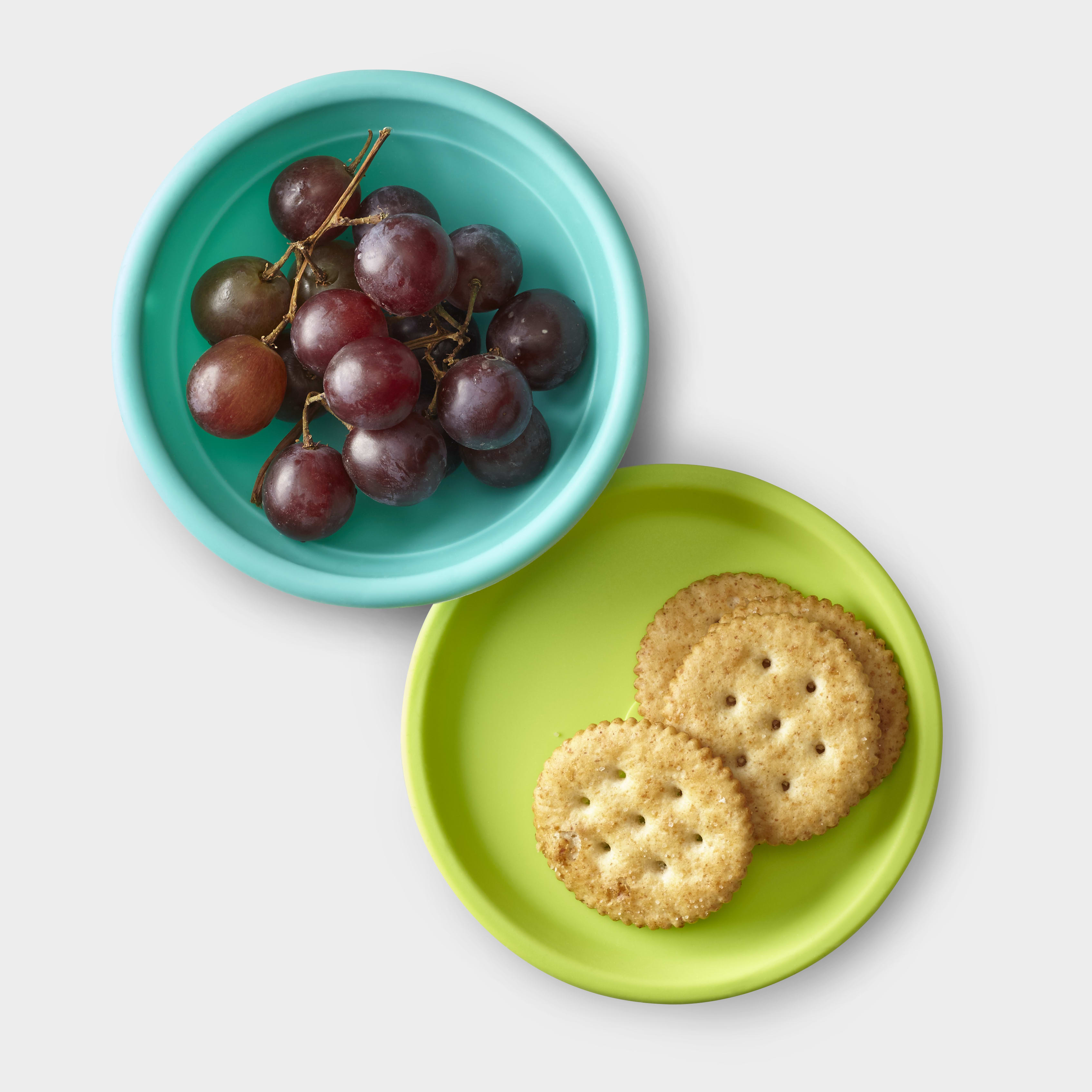 Family using GoSili silicone bowl and lid for meal prep and food storage.
